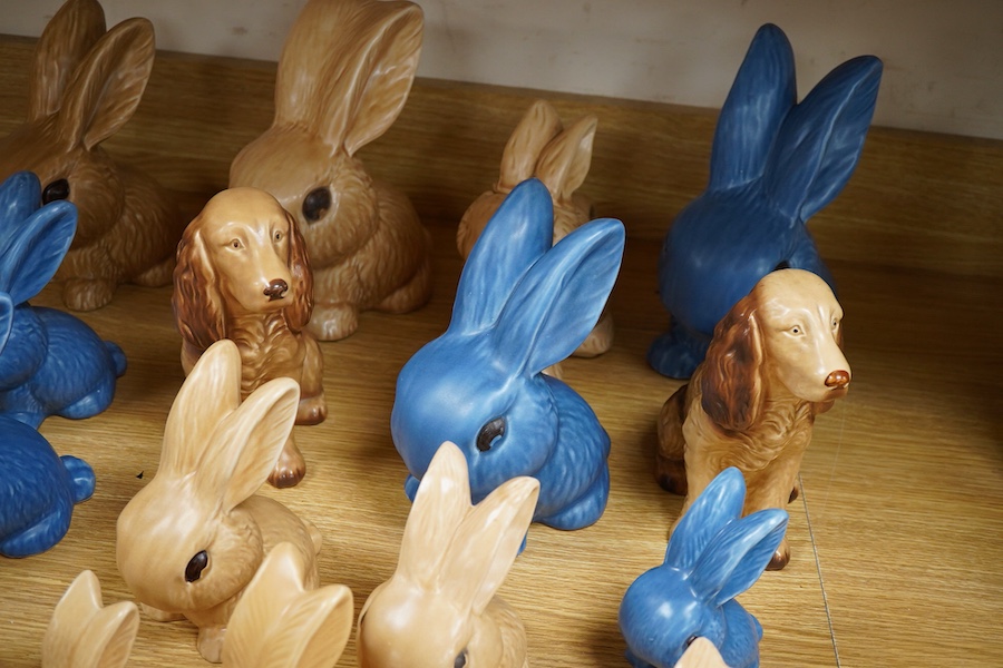 A collection of Sylvac bunny figures, one in the form of a teapot and a pair of dogs, largest 25cm high